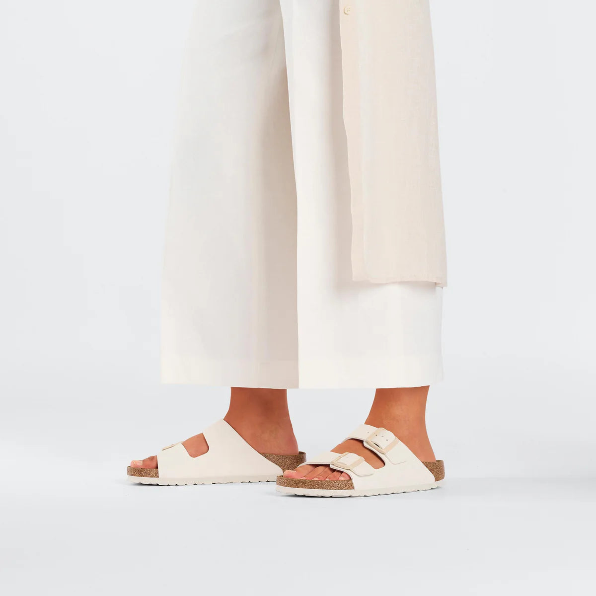 Birkenstock Arizona Birko-Flor in Eggshell worn on foot - Beachin Surf Toukley